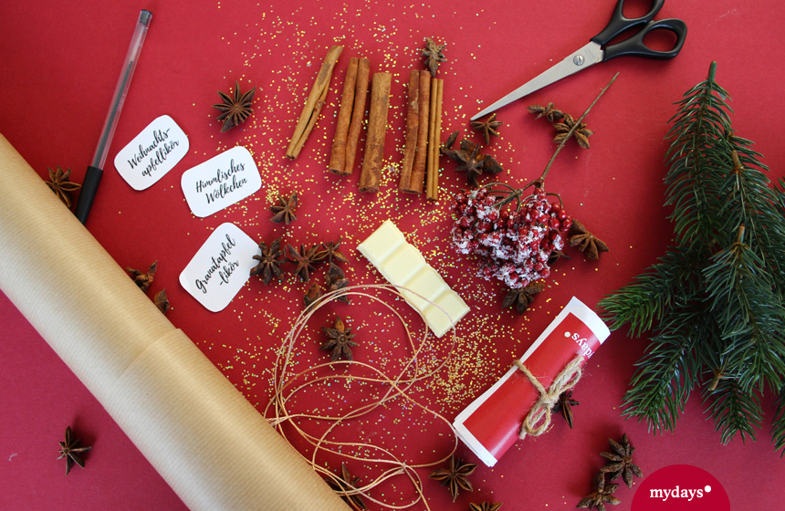 Weihnachtsliköre selber machen, weiße Schokolade, Tannenzweige, Zimtstangen, Packpapier, Schere, Geschenkband